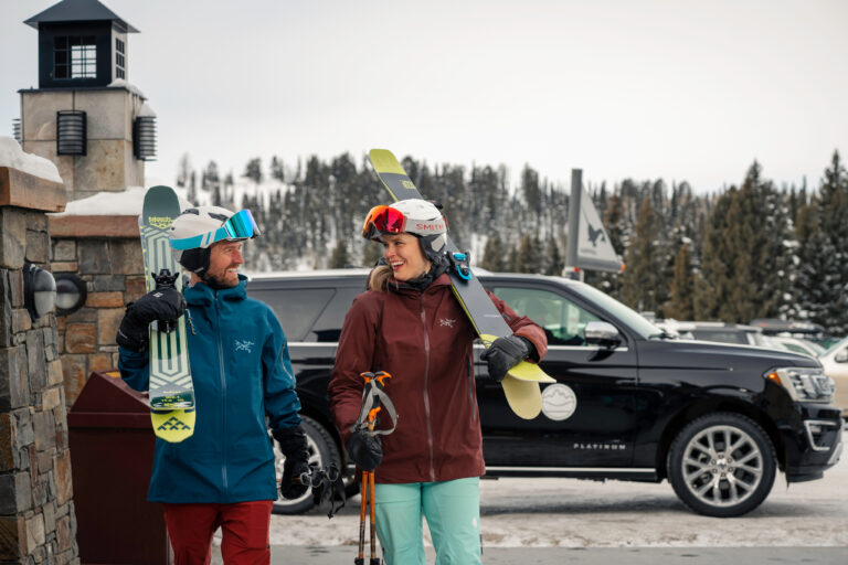 Tributary ski shuttle ferrying members door-to-mountain